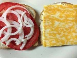 Onions on tomato sandwich