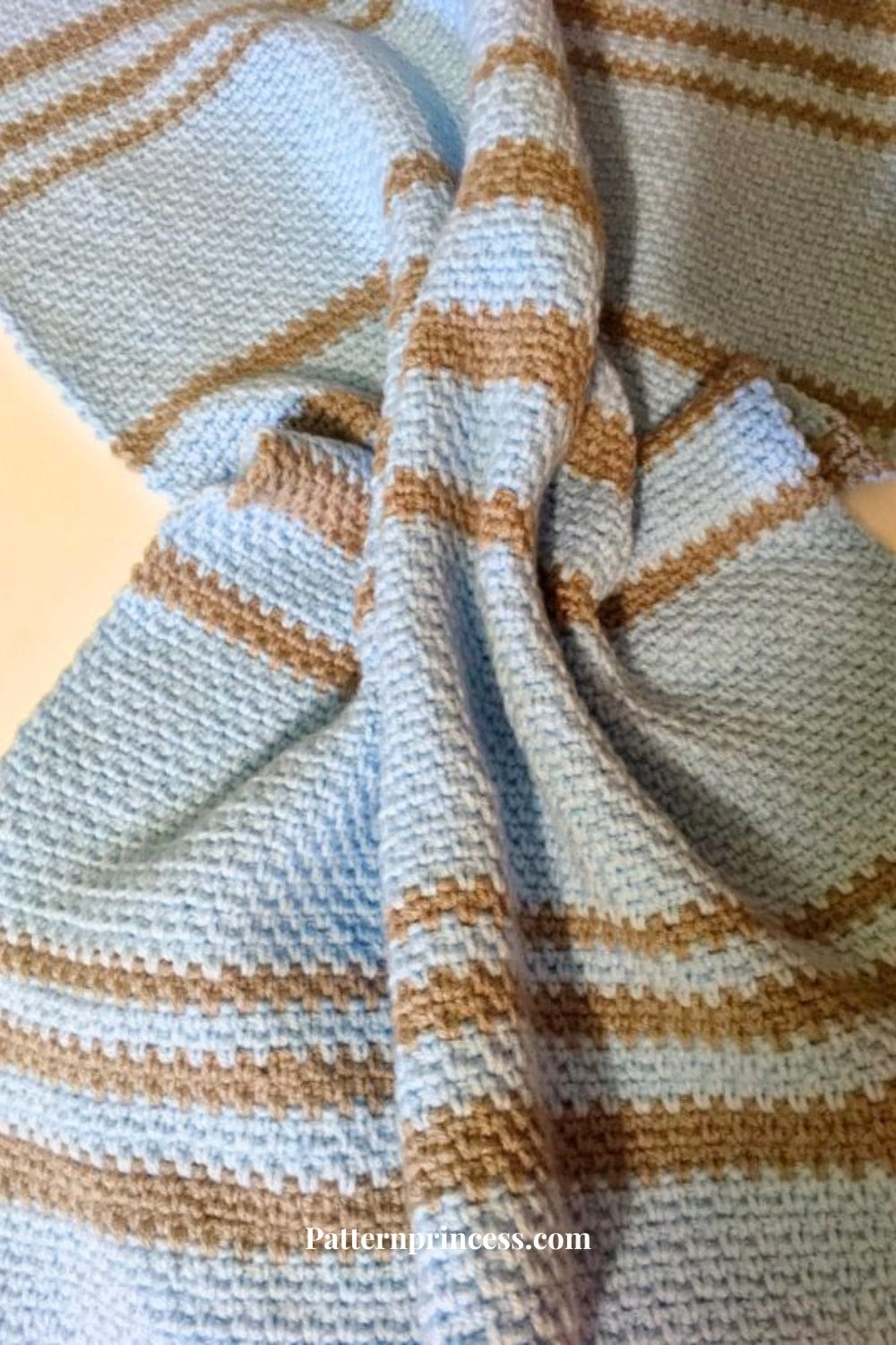 Linen stitch moss stitch striped baby blanket