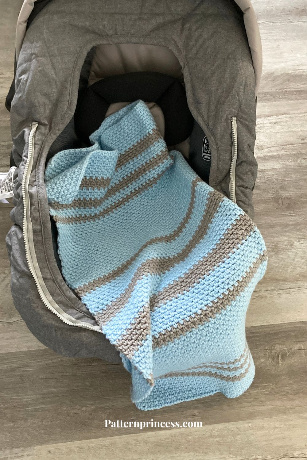 moss stitch baby blanket on car seat