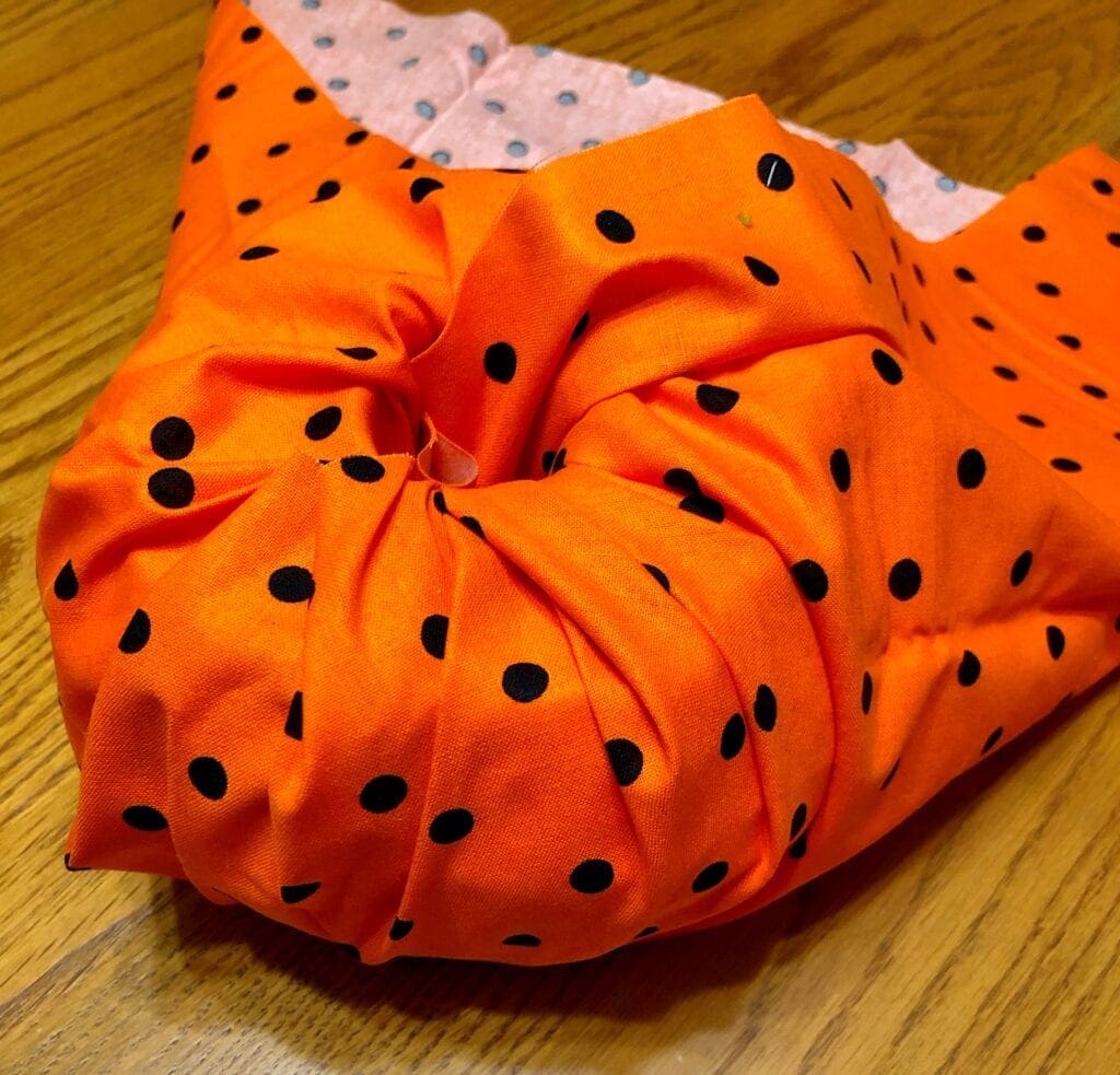 Continuing to Tuck Fabric in Center Hole