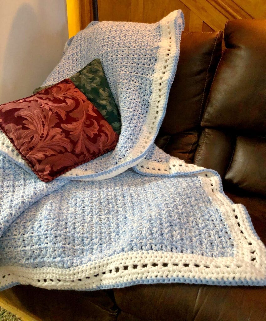 Blue Afghan on Sofa with Throw Pillows