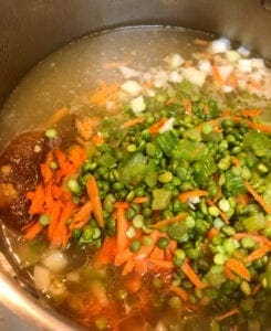 Adding Ham Juice, Onion, Carrot, Celery, and Split Peas to Soup