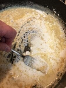 Adding the milk in the butter and flour mixture