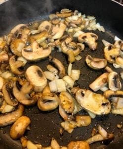 Cooking Mushrooms and Onions in Skillet