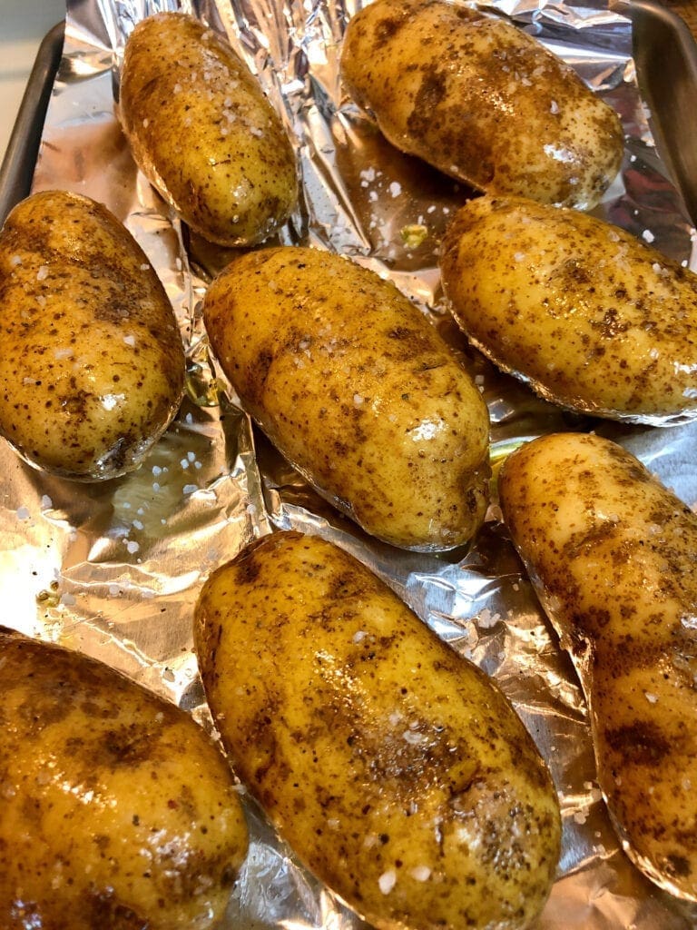 Preparing Potatoes for Baking on Baking Tray Lined with Foil