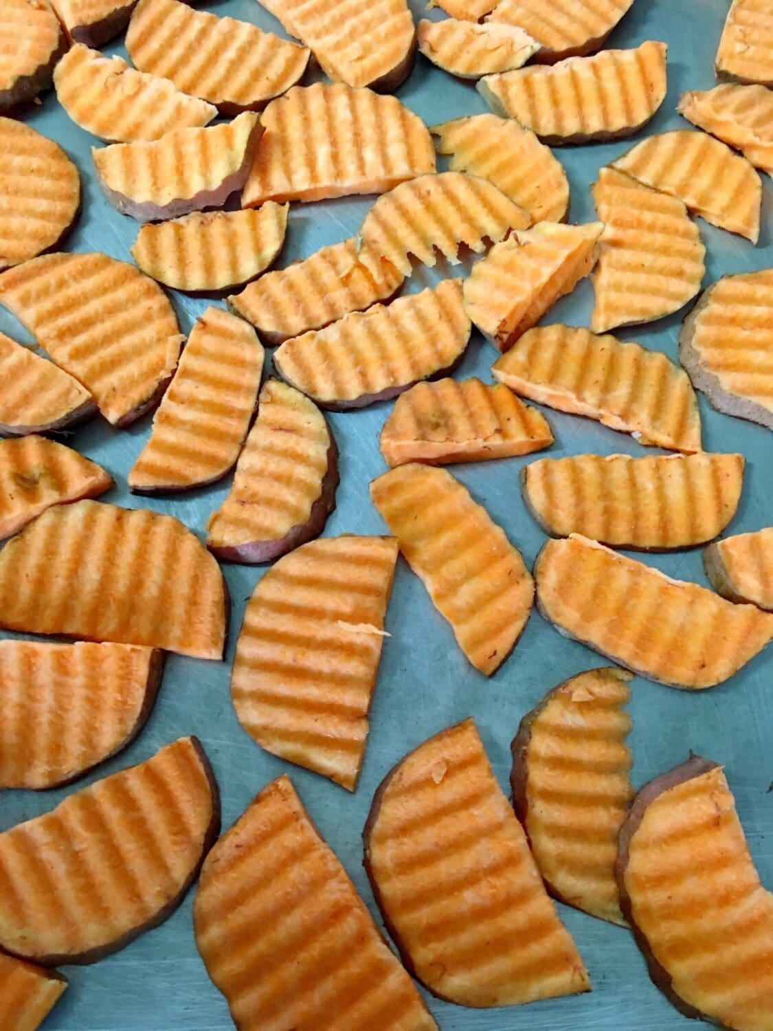 Sliced Yams Arranged on Baking Sheet