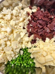 Cold Beef Pasta Salad Ingredients in Large Mixing Bowl