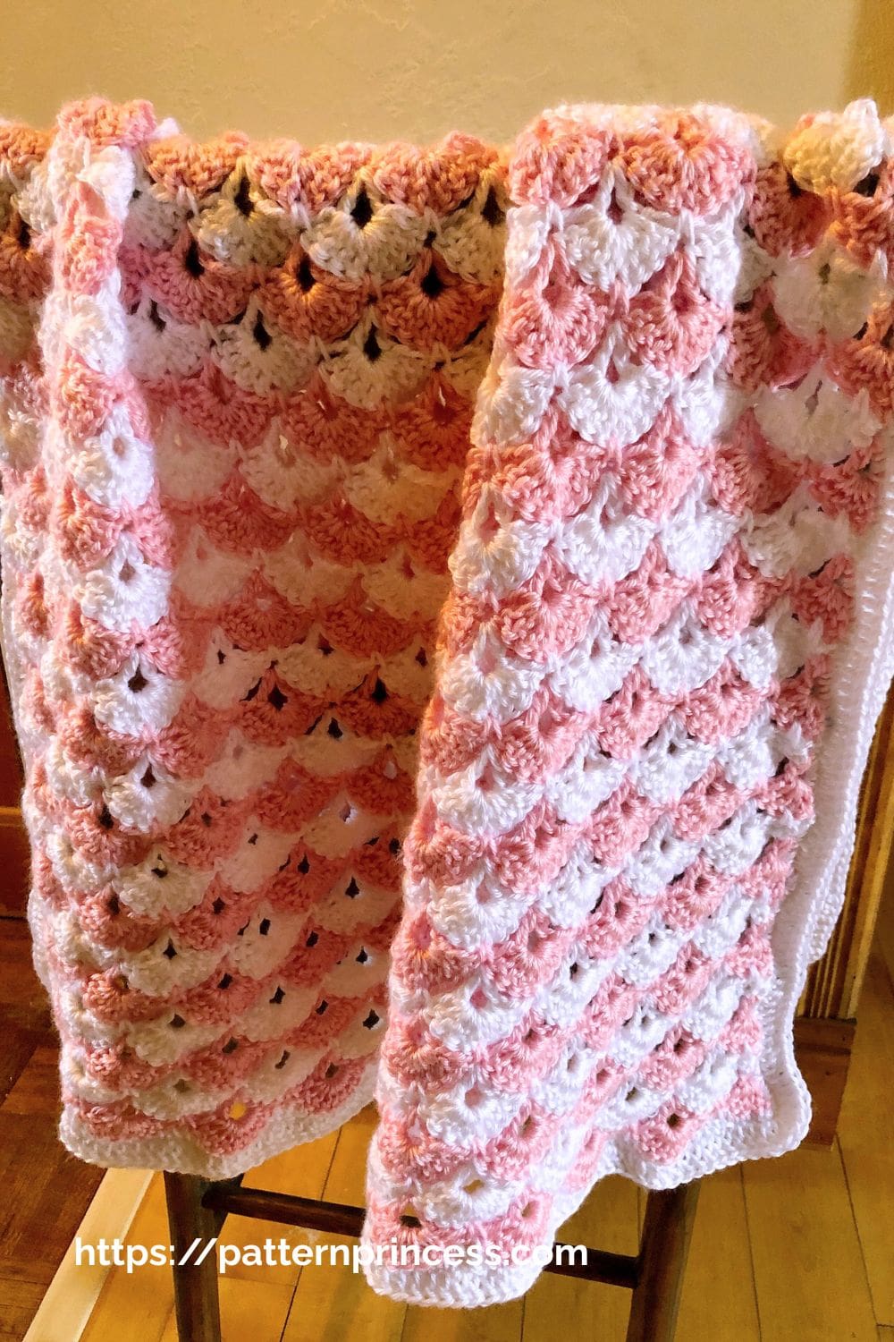 Lacy Shell Blanket in pink and white yarn