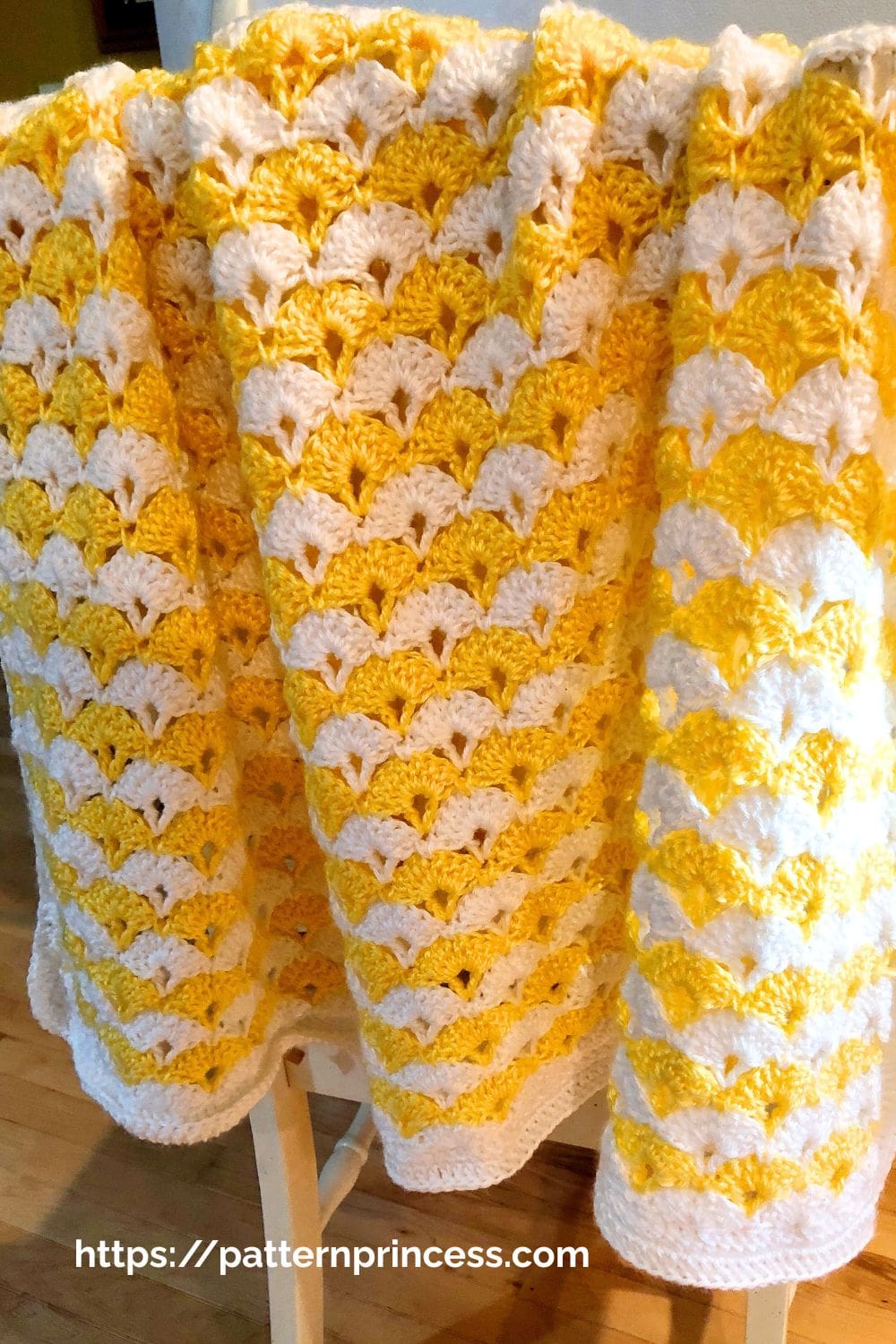Lacy Shell Blanket in yellow and white yarn