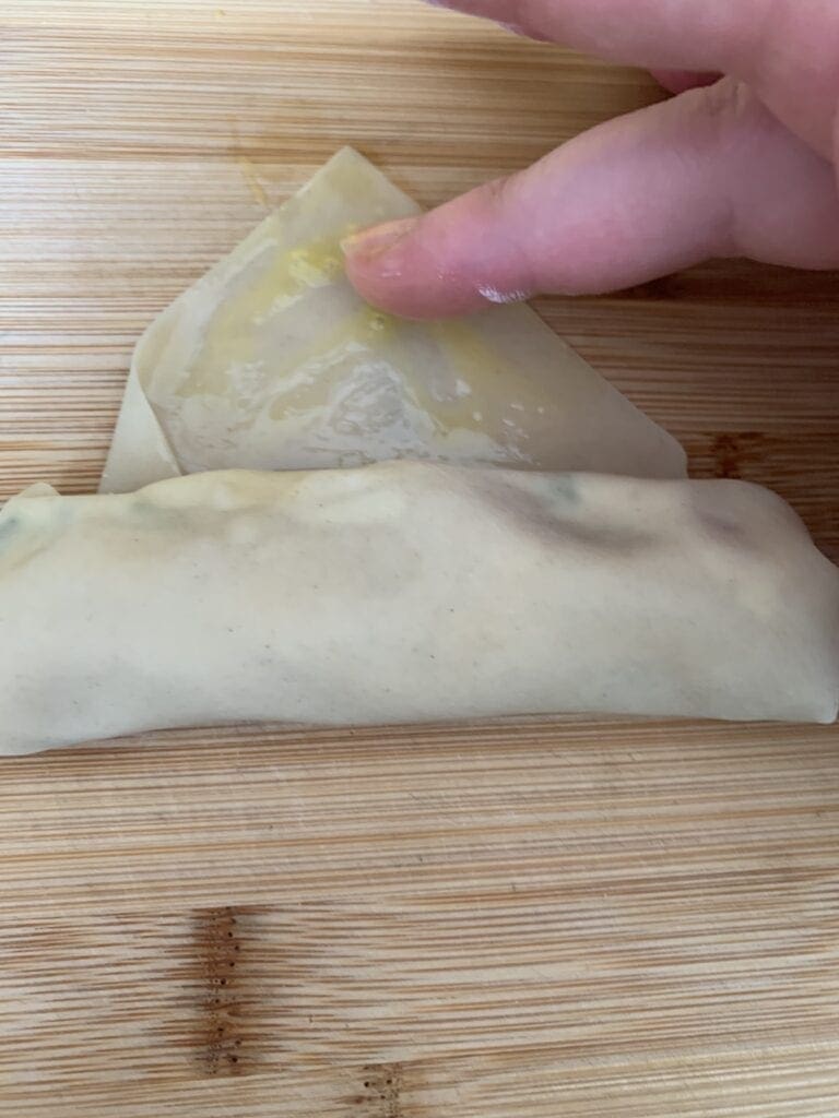 Moistening Egg Roll Wrapper with Beaten Egg