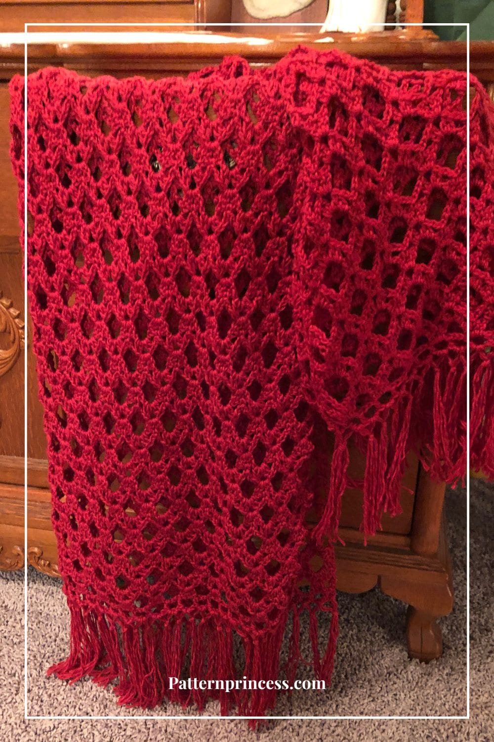 Lacy Crochet Throw Blanket Draped on Cabinet