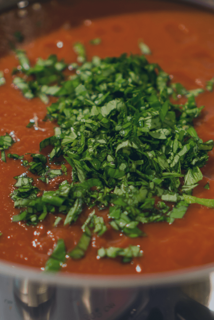 Adding Fresh Basil to the Spaghetti Sauce