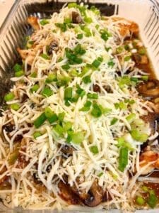 Adding Cheese and Green Onions to the Baked Dish