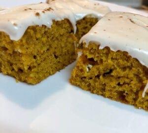 Serving Pumpkin Bars Topped with Frosting