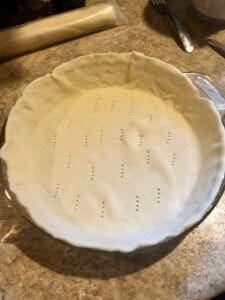 Pie Crust That Has Been Docked, Ready for Pre-Baking