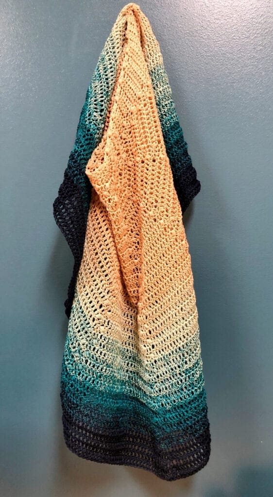 Crochet Beach Shawl Hanging on Hook