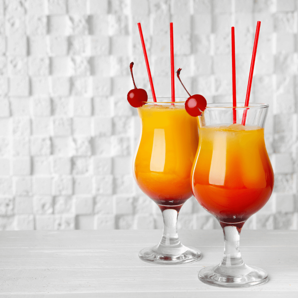 Amaretto Sunrise Mimosa Drink with Maraschino Cherries