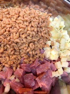 Adding Cooked and Cooled Legume Pasta to Salad