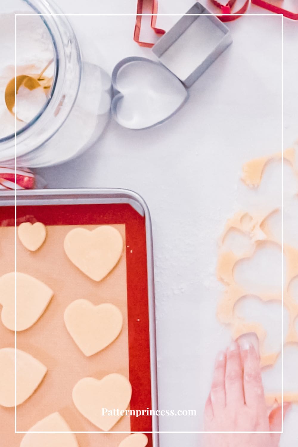 Valentines cut out cookies on baking mat