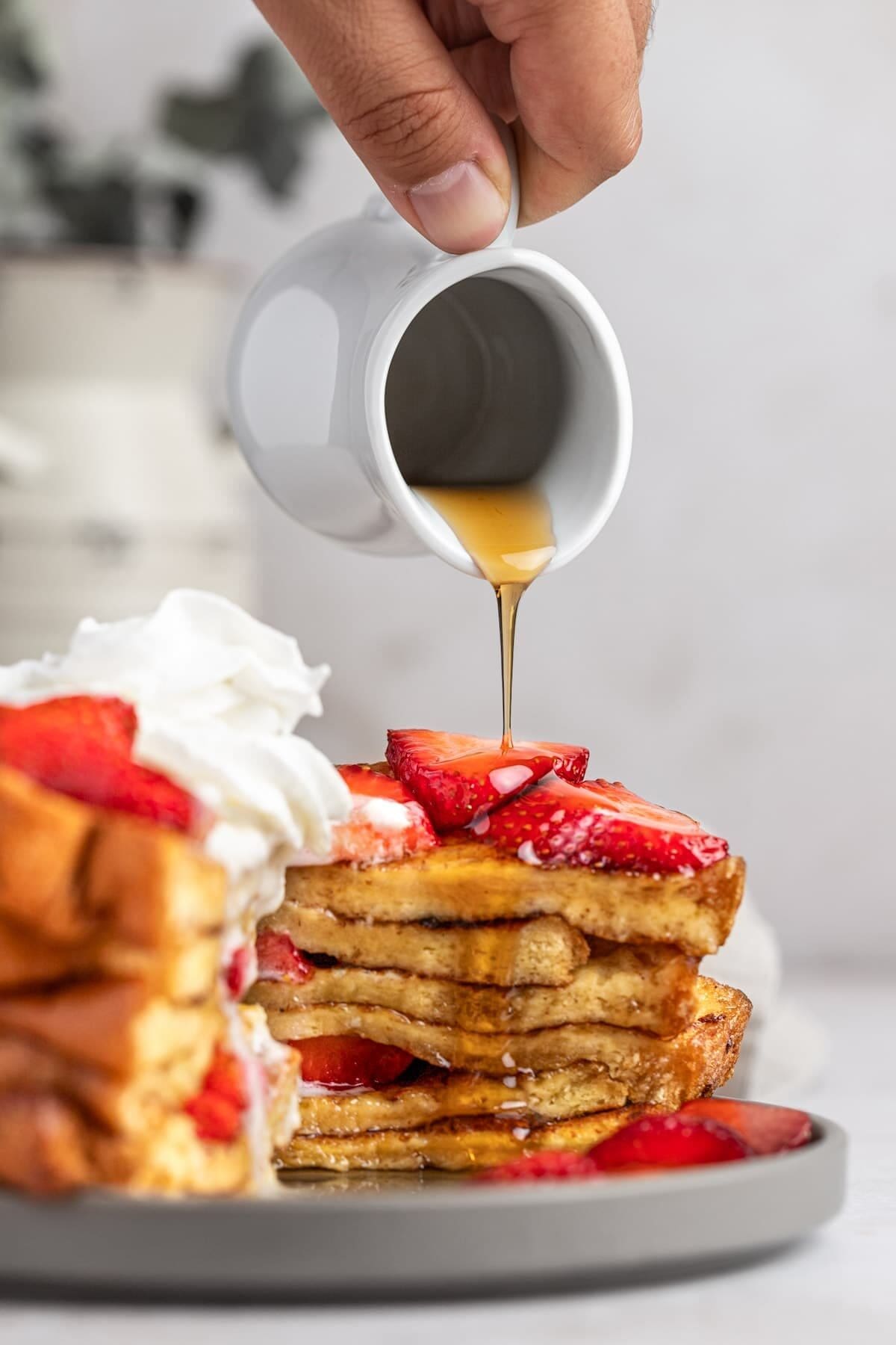 BUTTERMILK FRENCH TOAST with strawberries and syrup