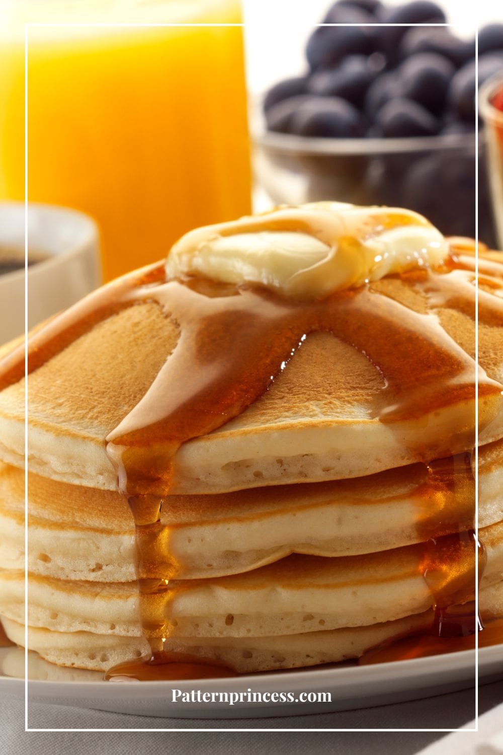 stack of buttermilk pancakes with butter and syrup