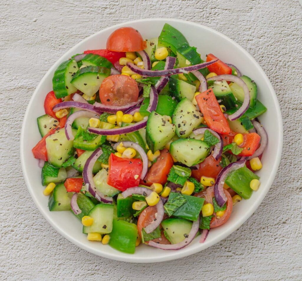 CORN CUCUMBER TOMATO SALAD WITH LEMON GARLIC DRESSING