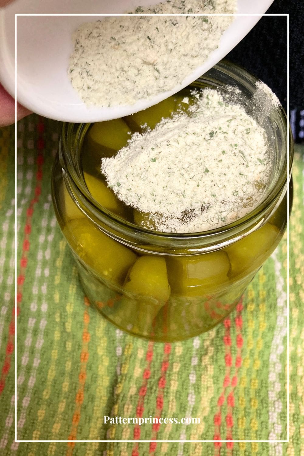 Adding the Ranch Seasoning to the Pickle Jar