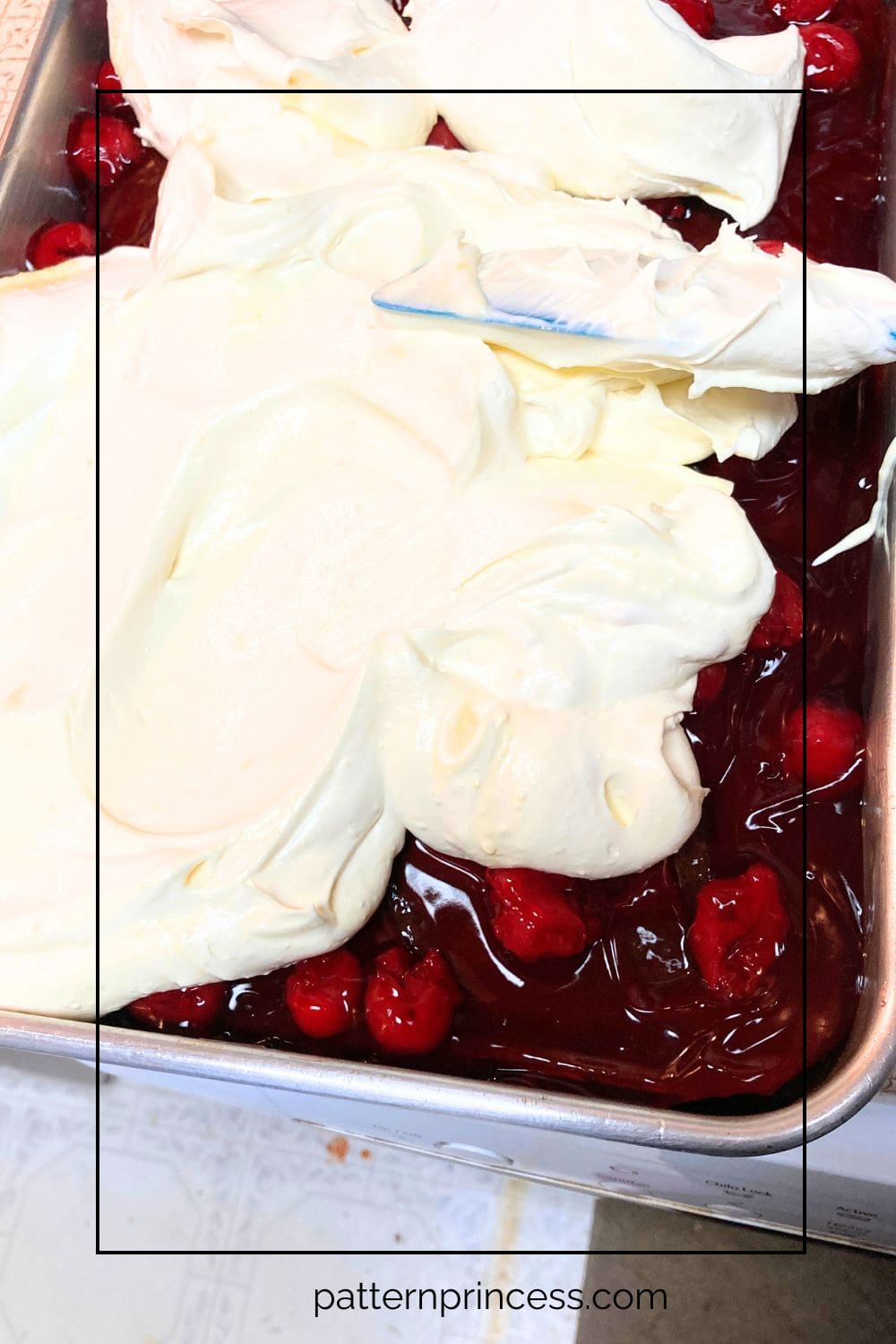 Spreading the Whipped Topping over the Cherries