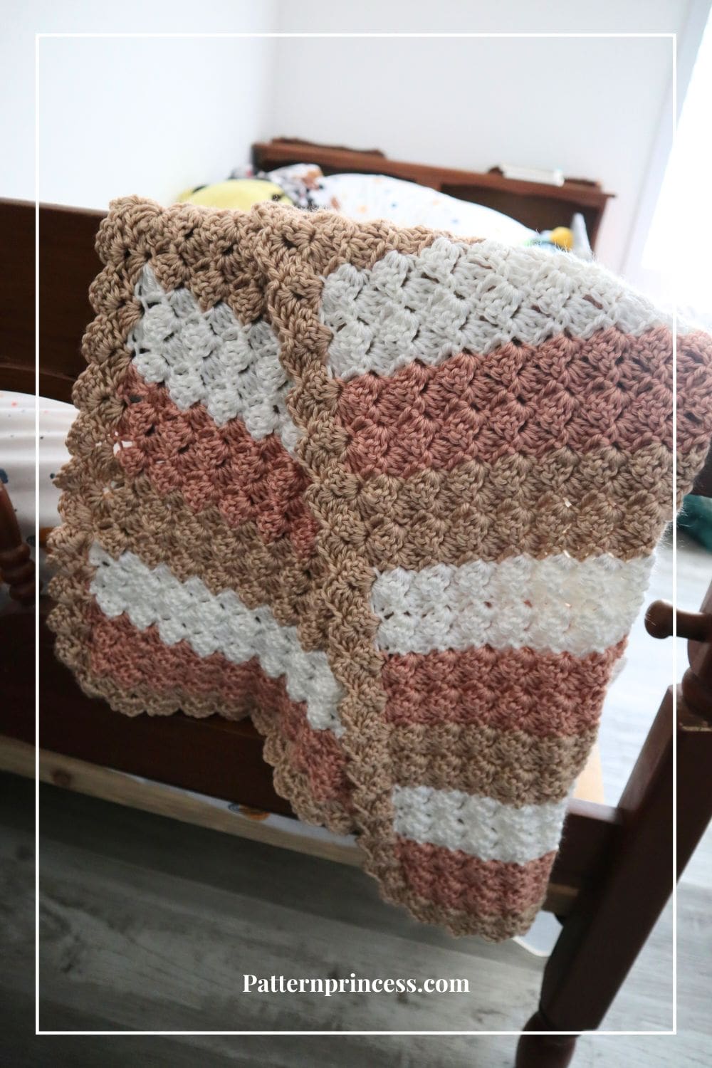 Striped Baby Blanket in Pastels on Bed