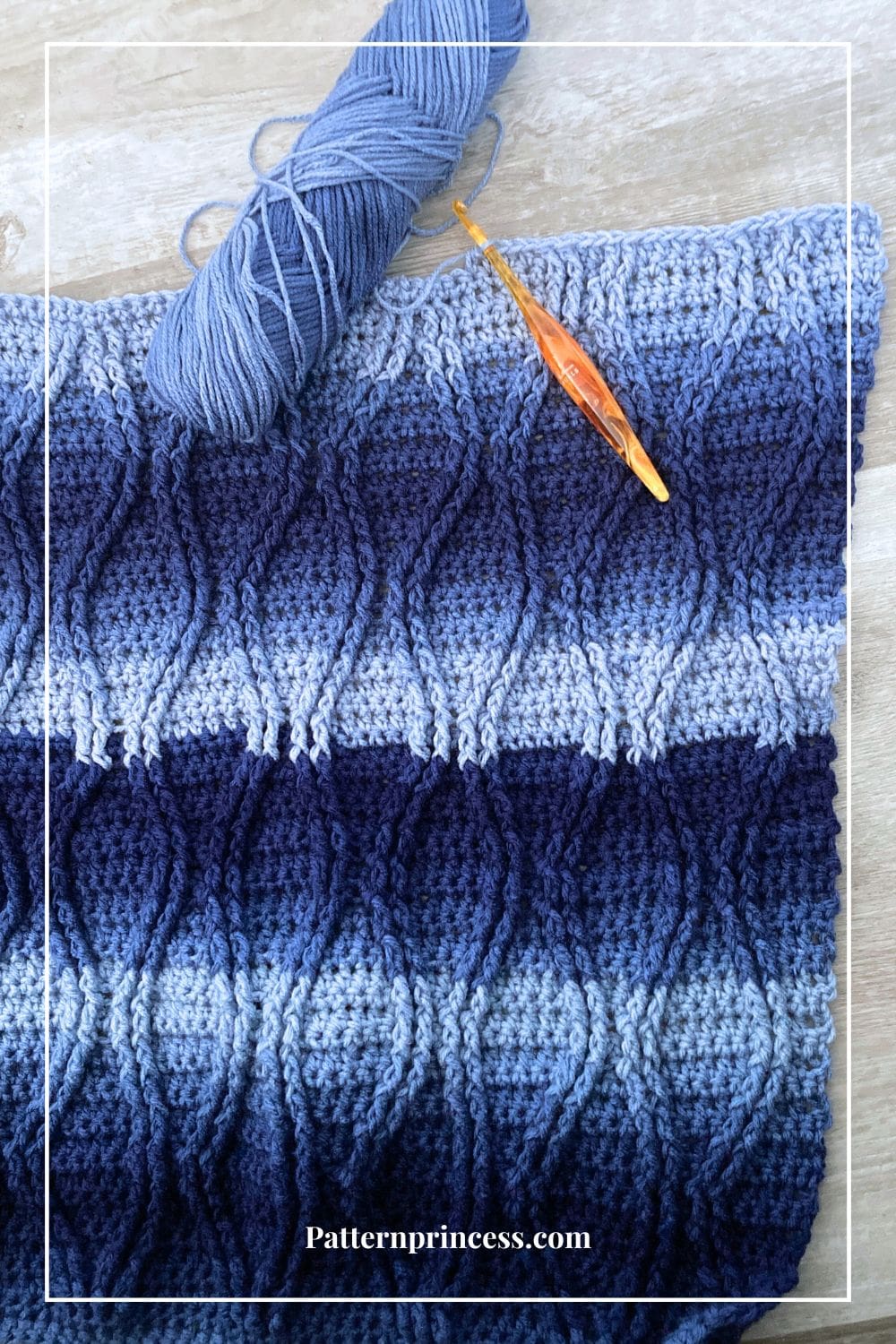 navy Blue ombre cabled blanket laying flat