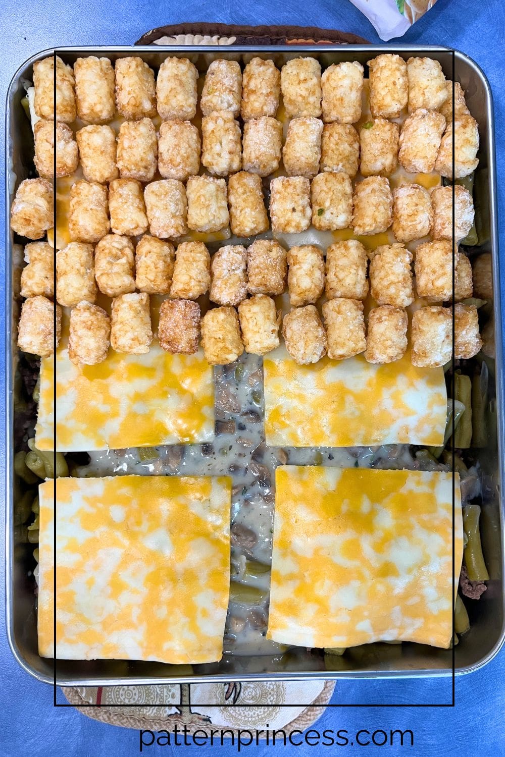 Layering the Ingredients for the Tater Tot Casserole