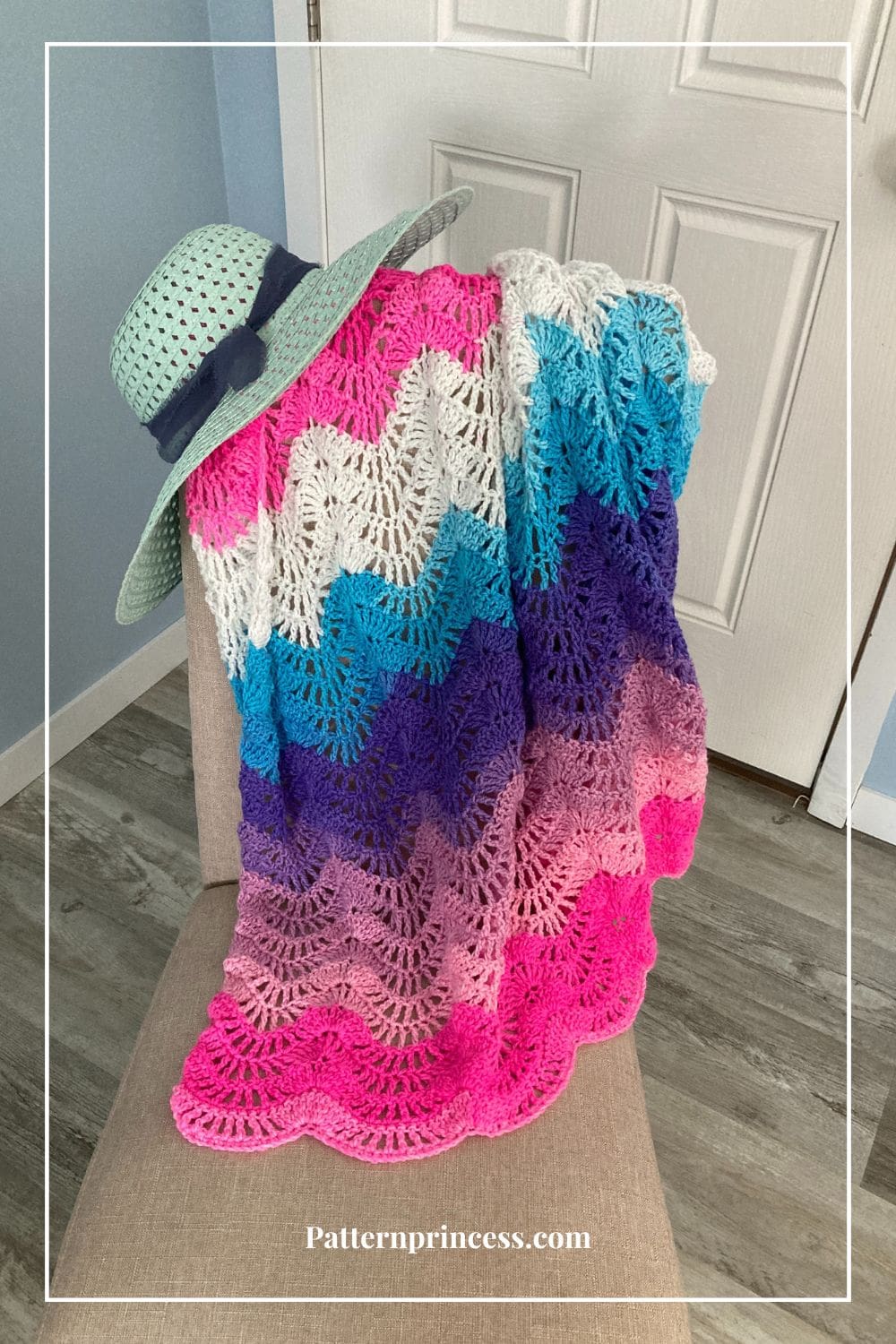 Beautiful Wavy Pastel Blanket on Chair with Sun Hat
