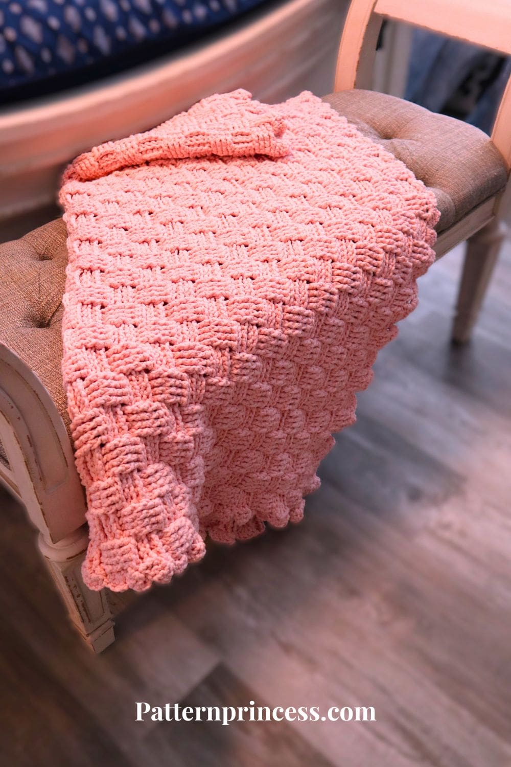 Blush Glam Plush Throw Blanket on Stool