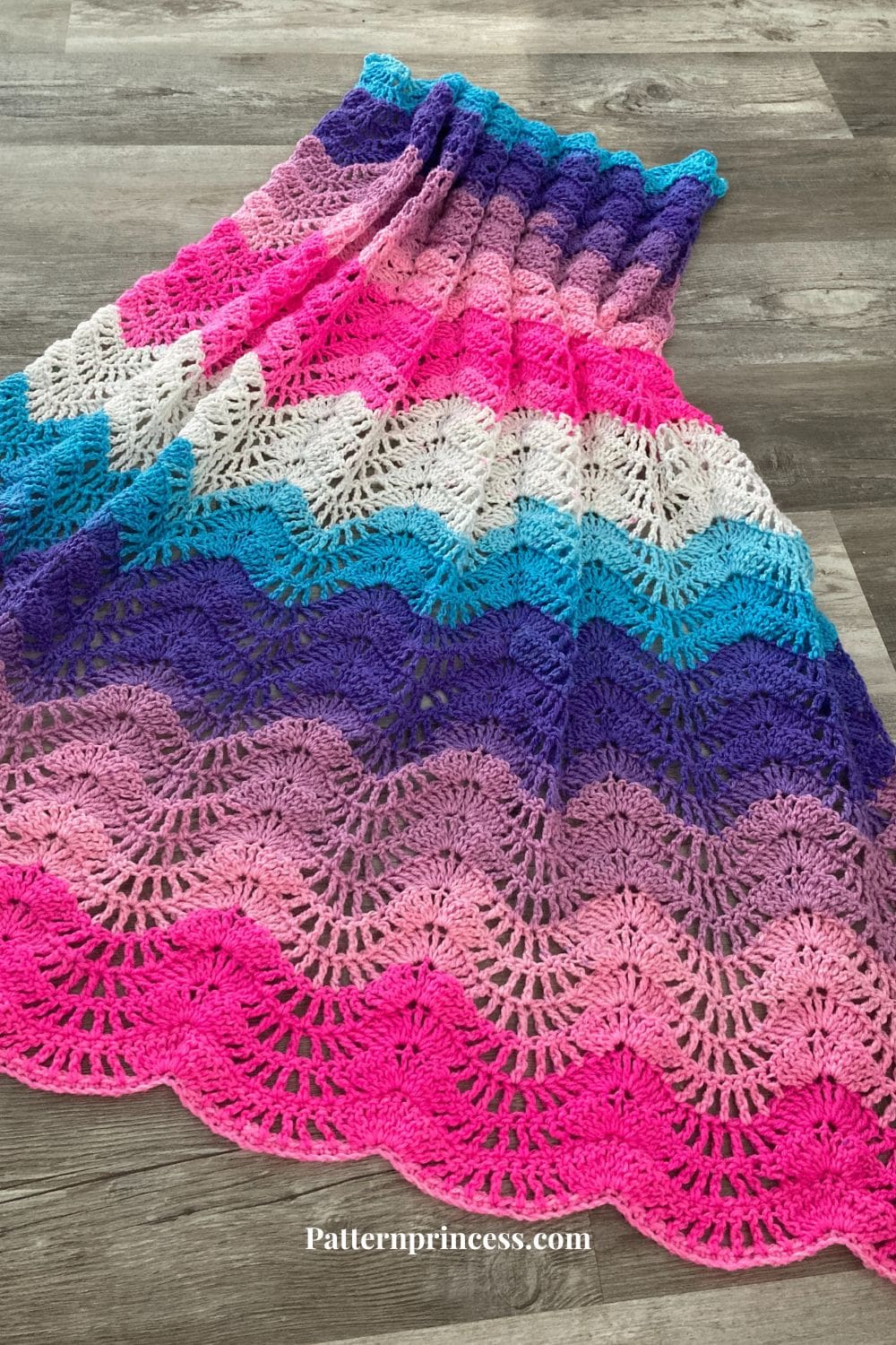 Close up of feather and fan baby blanket