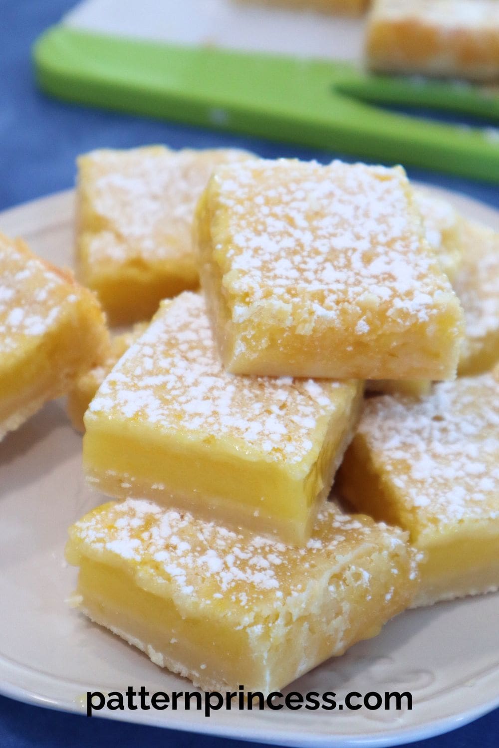 Lemon Bars Stacked on Plate