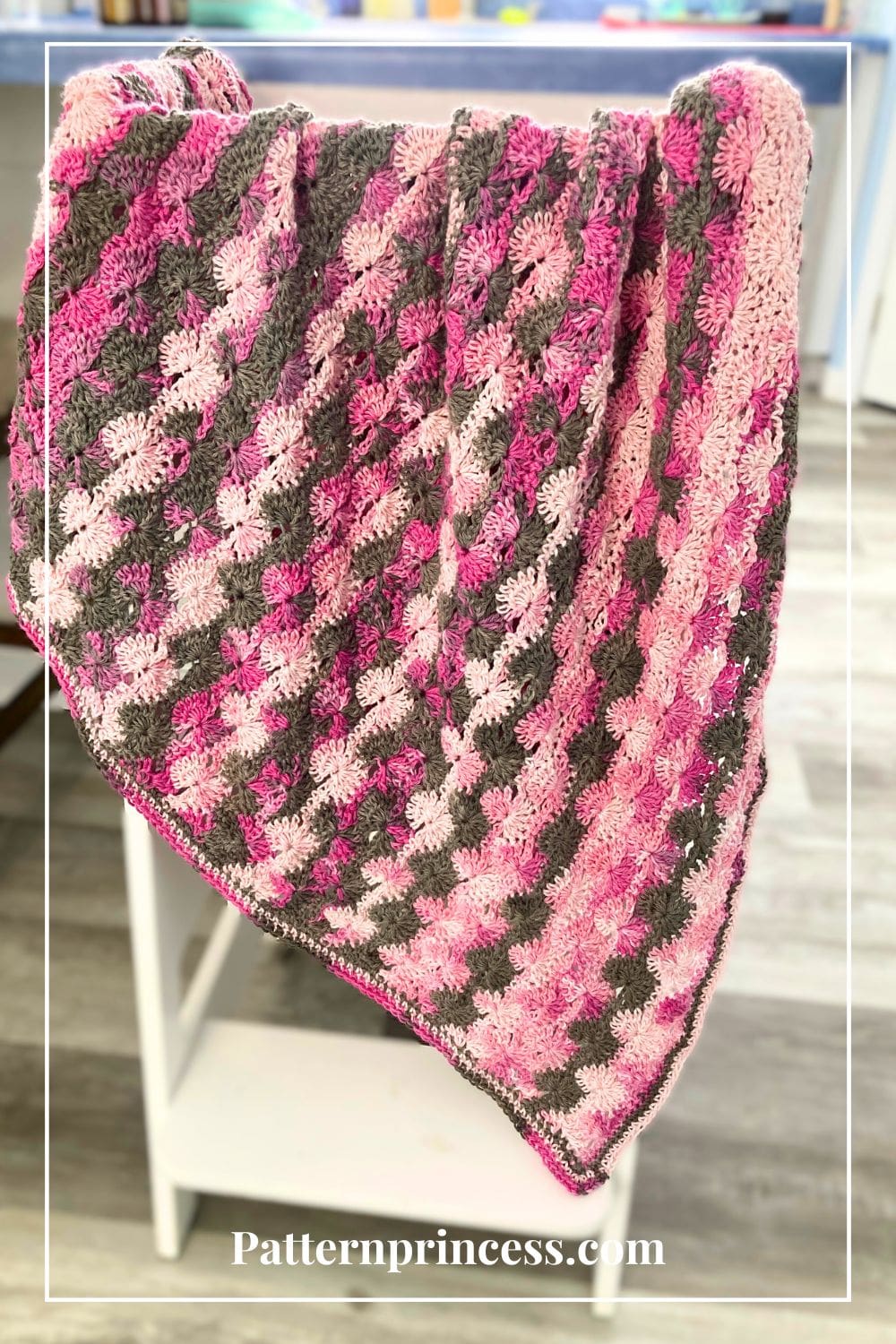 Pink Camo Baby Blanket on stool