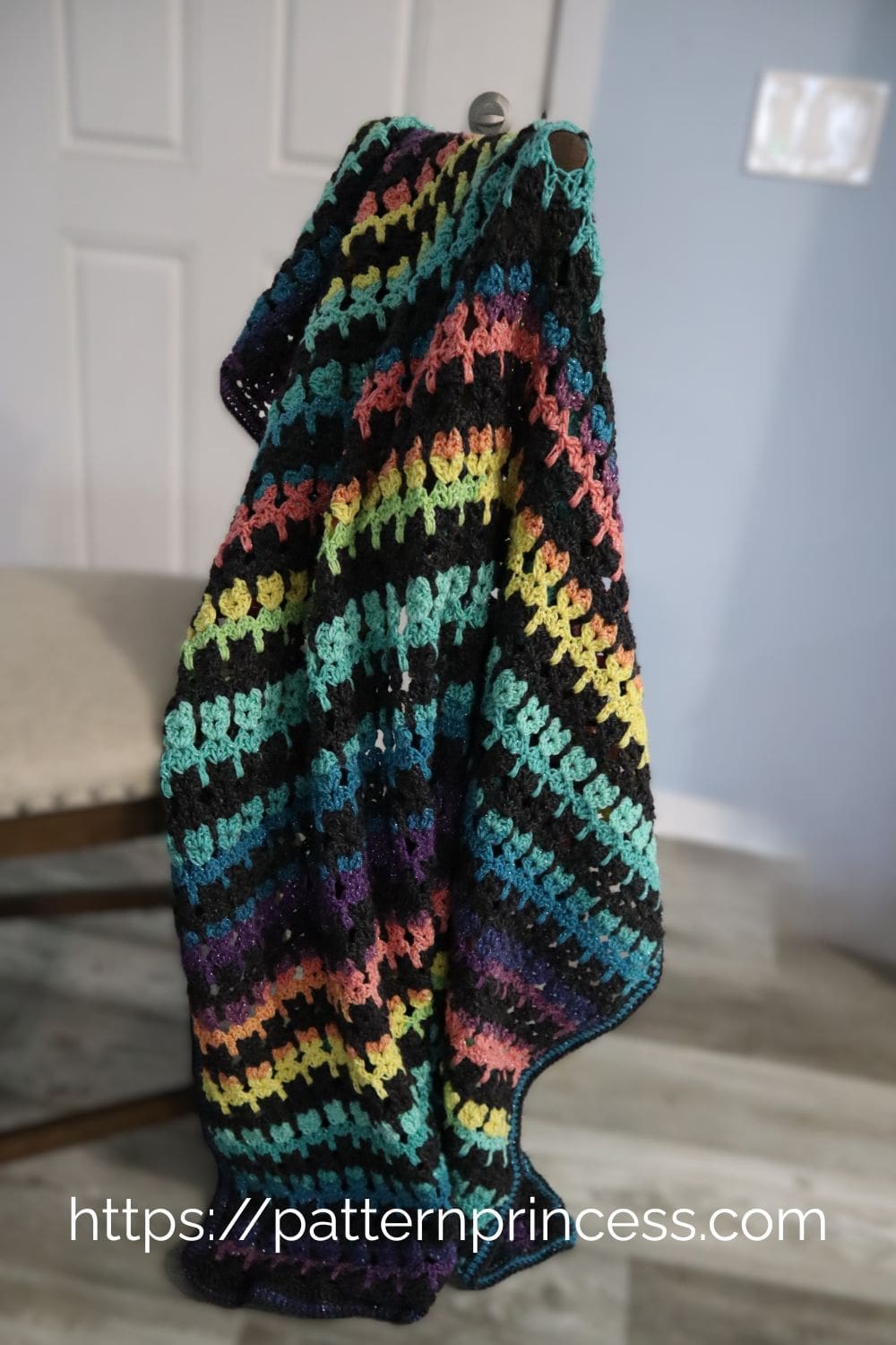 Beautiful multi-color striped blanket on chair