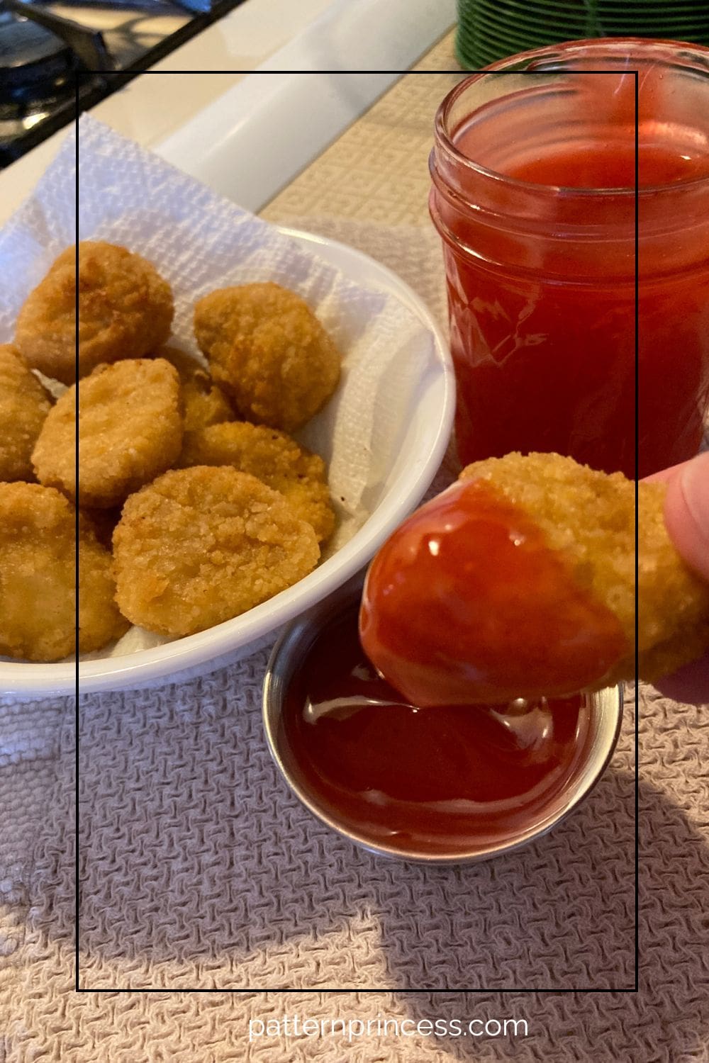 Dipping Chicken in Nuggets in Sweet Sour Sauce