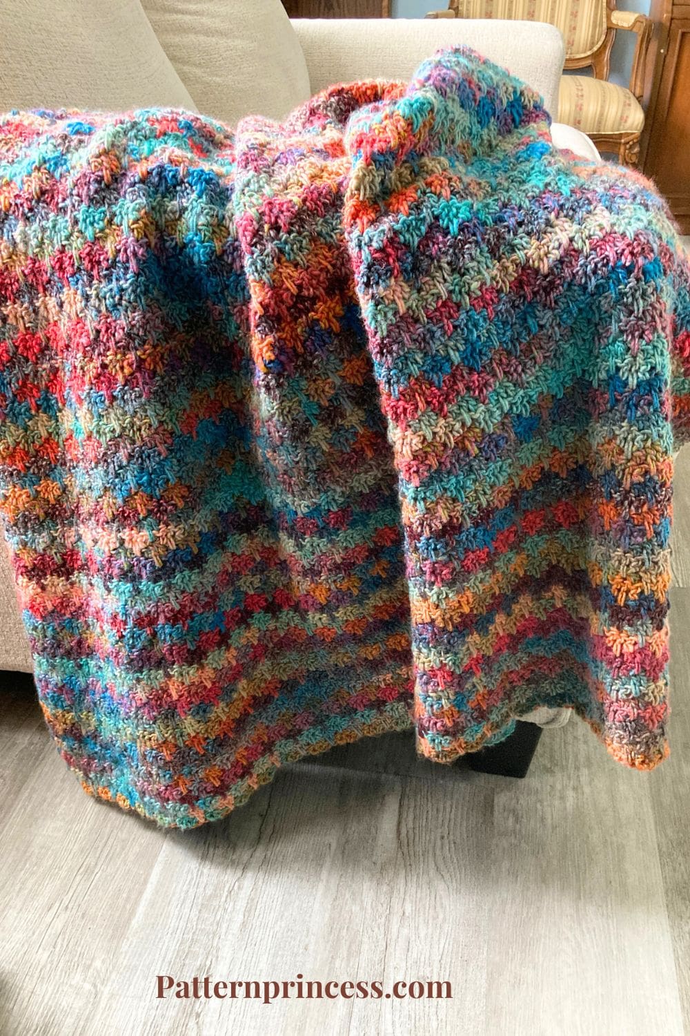 Spike Stitch Trio Variegated Yarn Blanket on Sofa